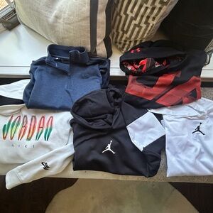 A bundle of Boys Nike Jordan and Under Armour Hoodies and sweatshirts.